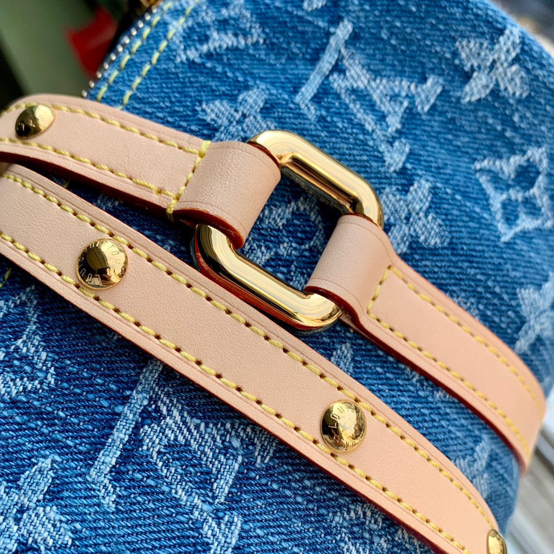 PAPILLON 27 IN BLUE MONOGRAM DENIM GOLD HARDWARE